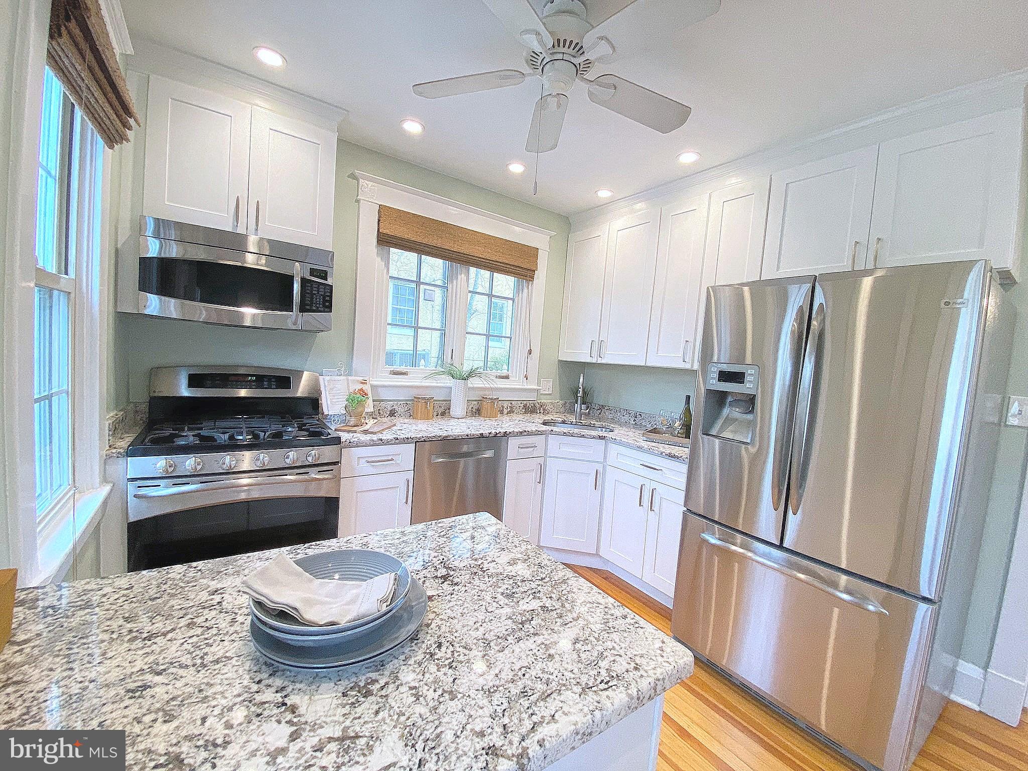306 St Dunstans Road Baltimore, MD 21212 - Photo 20 of 56 a kitchen with a stove a refrigerator and a sink