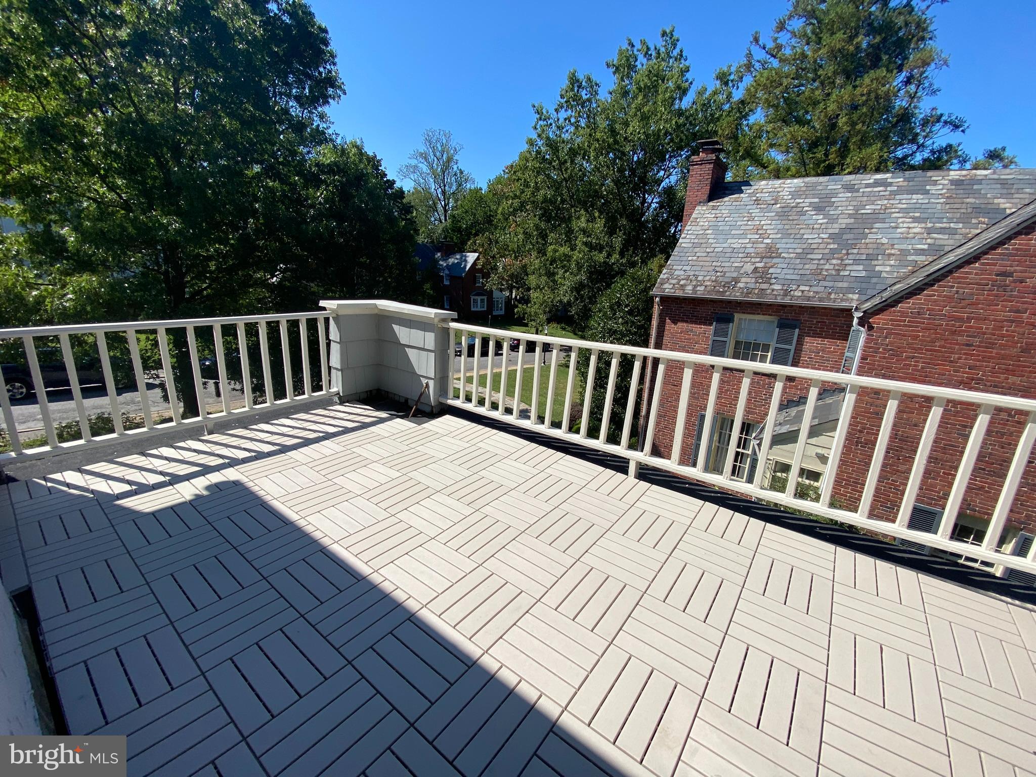 306 St Dunstans Road Baltimore, MD 21212 - Photo 36 of 56 a view of balcony with wooden floor and fence