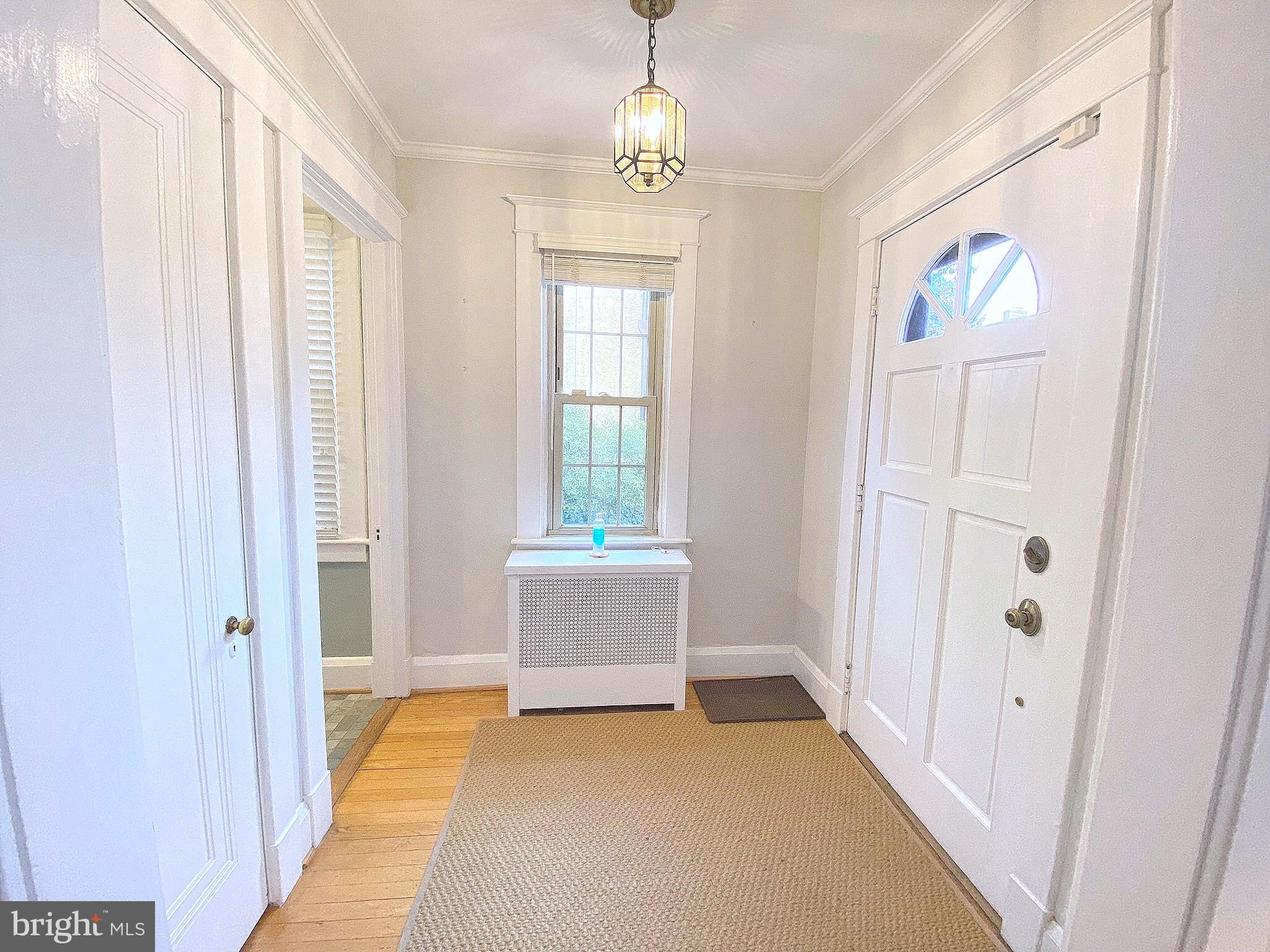 306 St Dunstans Road Baltimore, MD 21212 - Photo 4 of 56 a view of room with window and hardwood floor