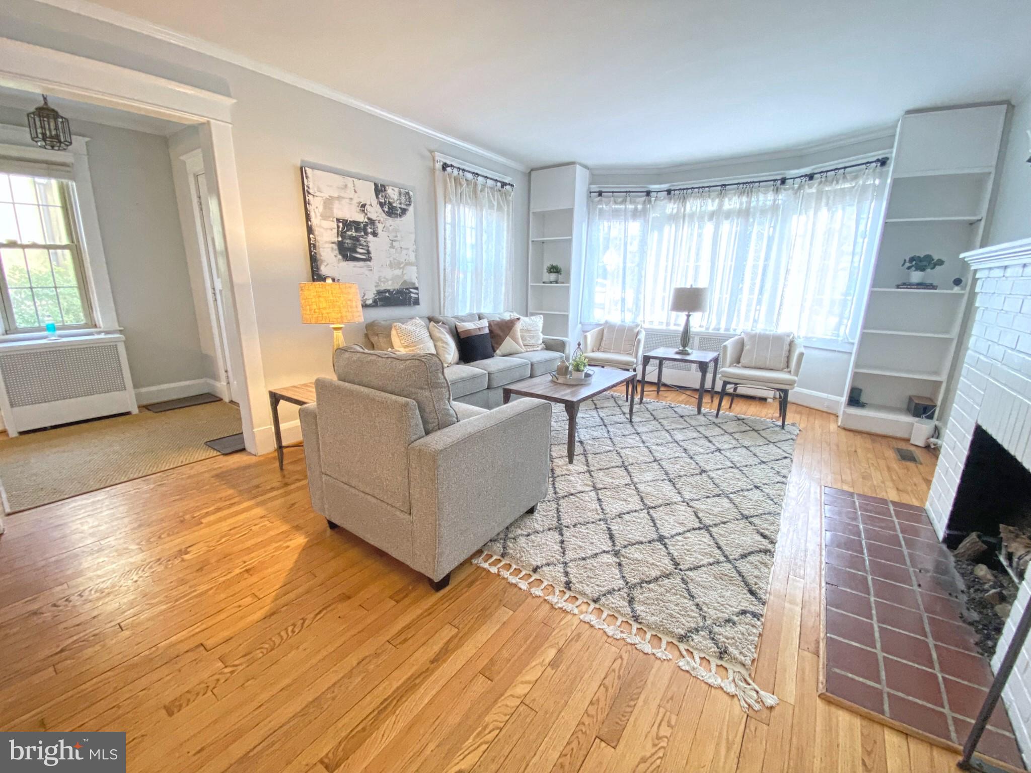 306 St Dunstans Road Baltimore, MD 21212 - Photo 6 of 56 a living room with furniture and a flat screen tv