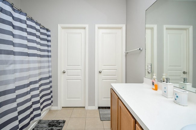 3318 Grand Cane Lane Rosenberg, TX 77471 - Photo 13 of 19 a bathroom with a sink a toilet and shower