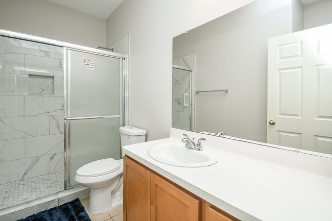 3318 Grand Cane Lane Rosenberg, TX 77471 - Photo 16 of 19 a bathroom with a sink toilet and shower