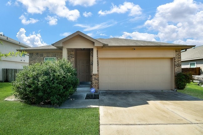 3318 Grand Cane Lane Rosenberg, TX 77471 - Photo 3 of 19 a view of a house with a yard plants and large tree
