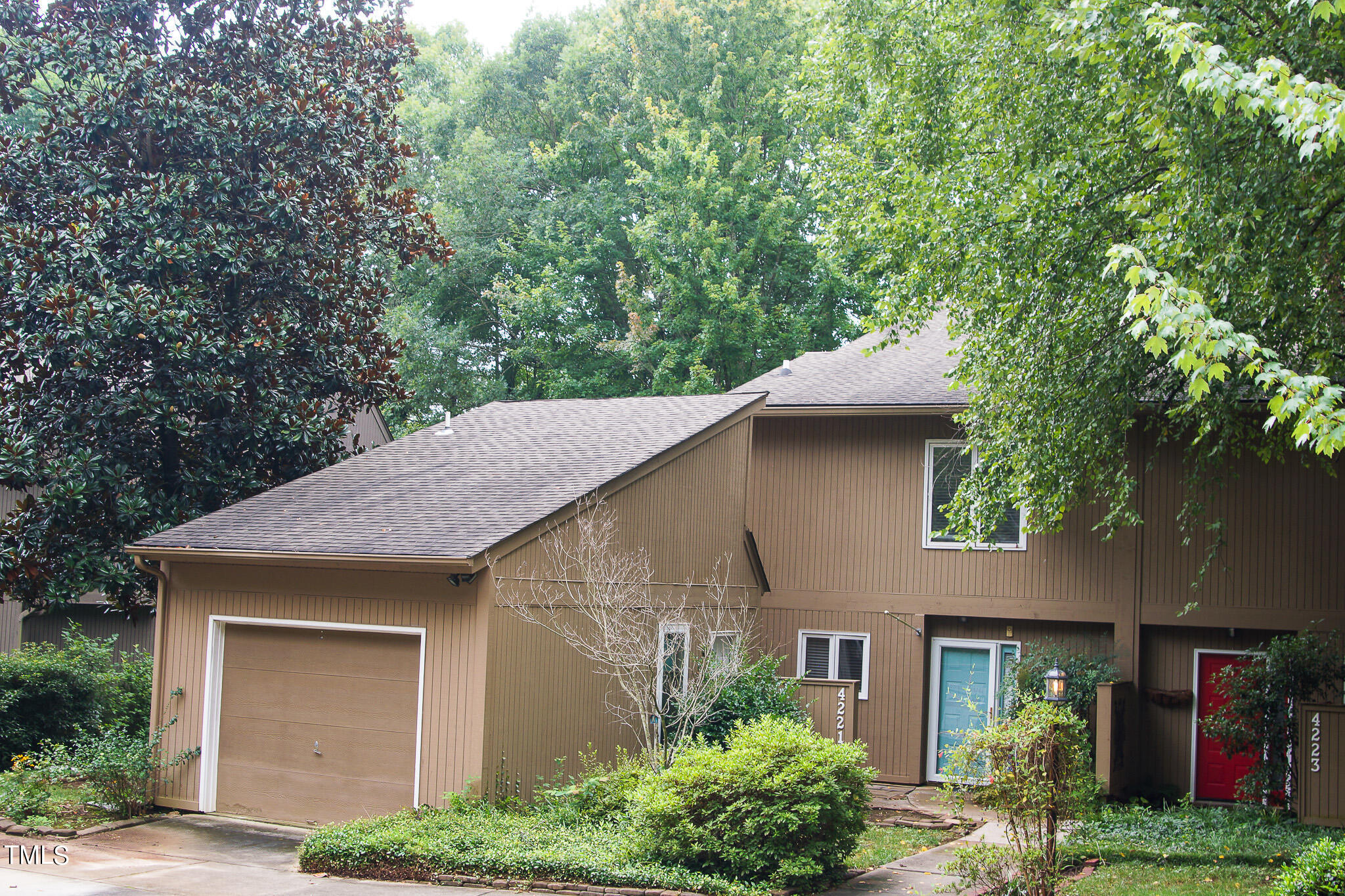 4221 Sunscape Lane Raleigh, NC 27613 - Photo 1 of 29 a front view of a house with garden