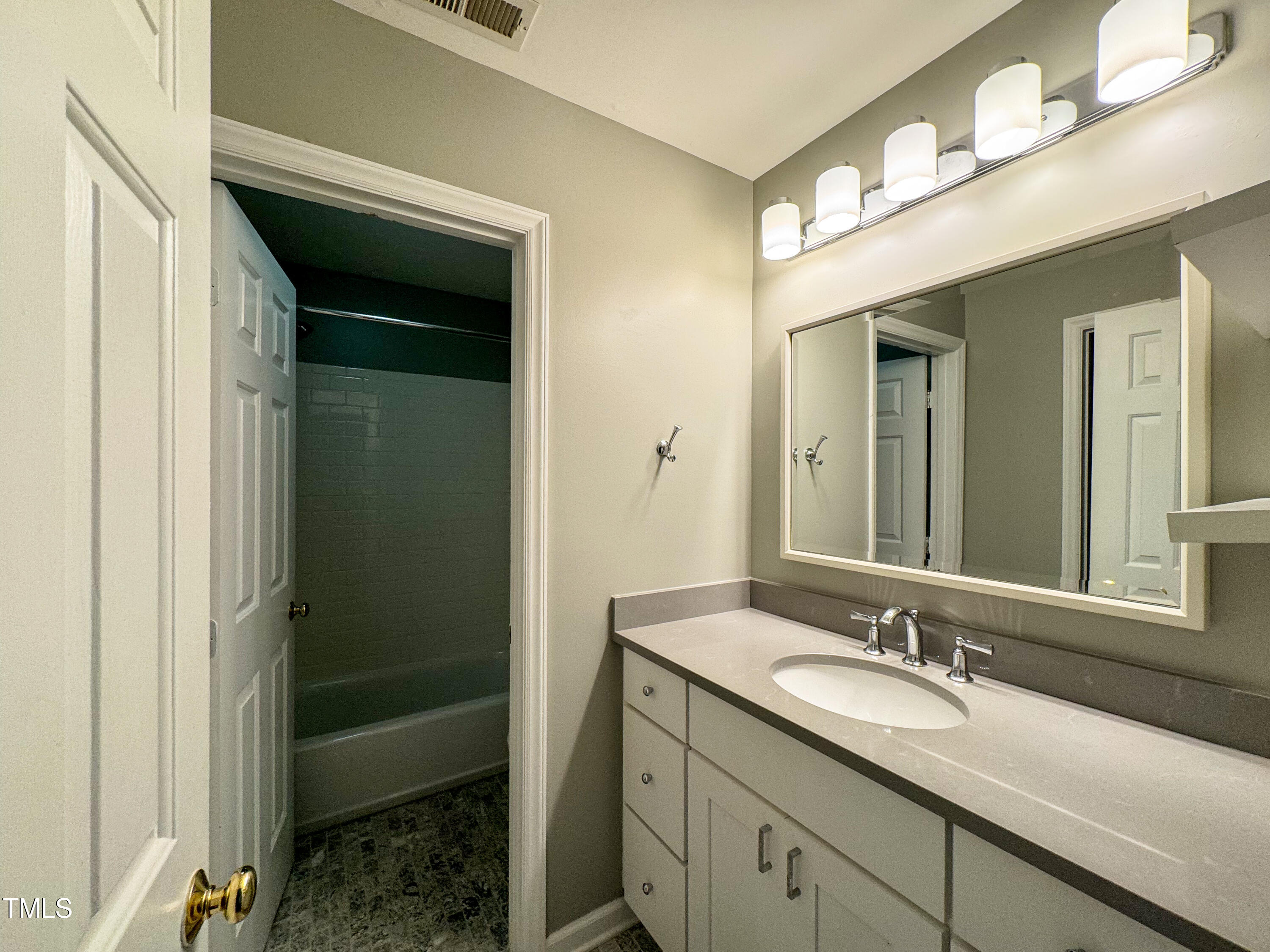 4221 Sunscape Lane Raleigh, NC 27613 - Photo 15 of 29 a bathroom with a sink double vanity and a mirror