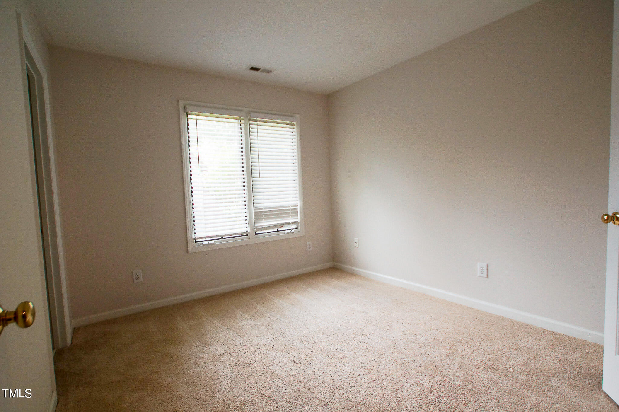 4221 Sunscape Lane Raleigh, NC 27613 - Photo 16 of 29 a view of an empty room with a window