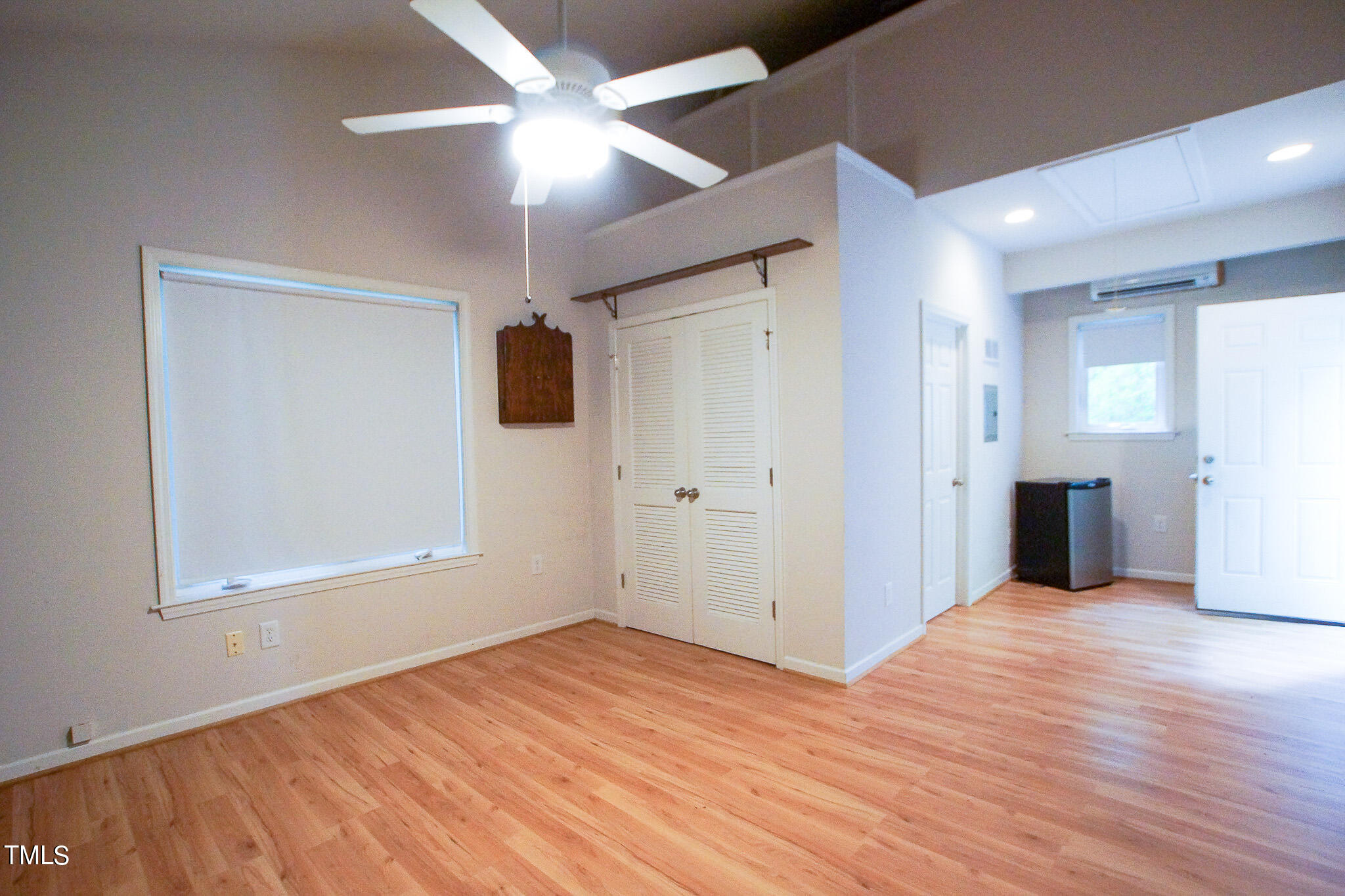 4221 Sunscape Lane Raleigh, NC 27613 - Photo 17 of 29 an empty room with wooden floor and windows
