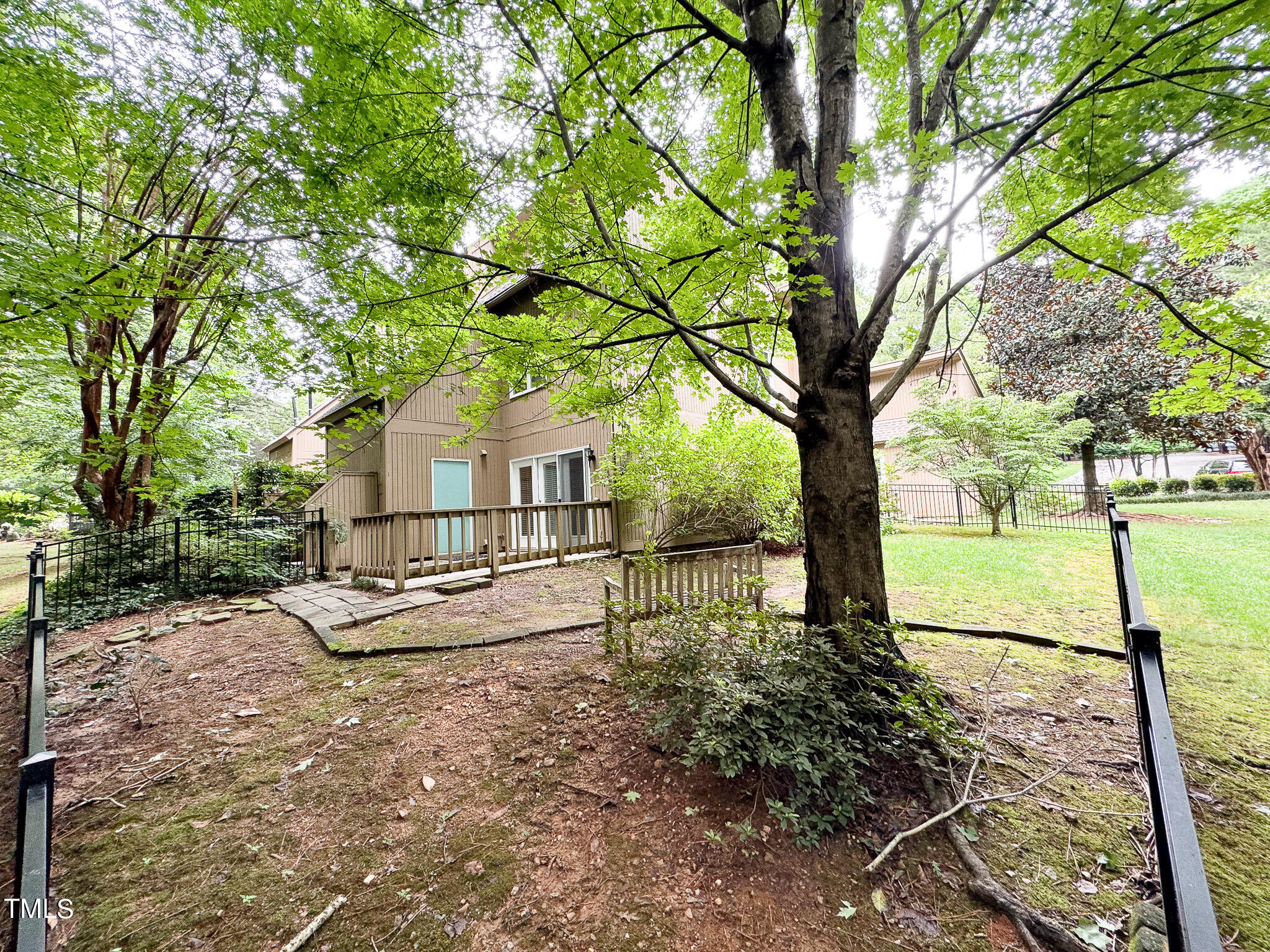 4221 Sunscape Lane Raleigh, NC 27613 - Photo 27 of 29 a view of house with backyard and trees