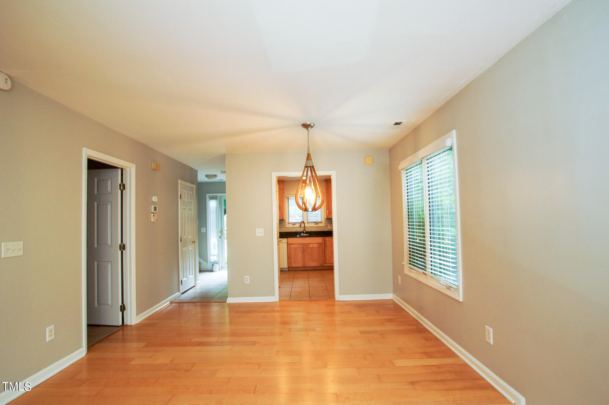 4221 Sunscape Lane Raleigh, NC 27613 - Photo 8 of 29 a view of an empty room with window and bathroom