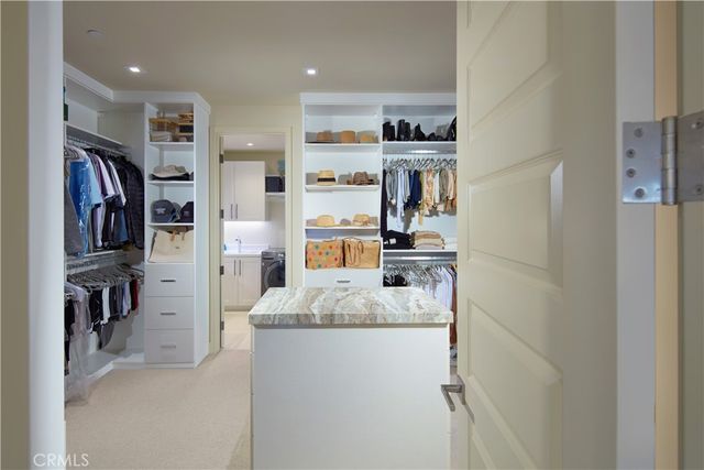 a kitchen with a refrigerator and a sink
