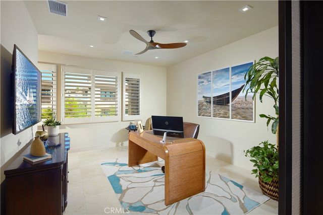 a living room with furniture fireplace and flat screen tv