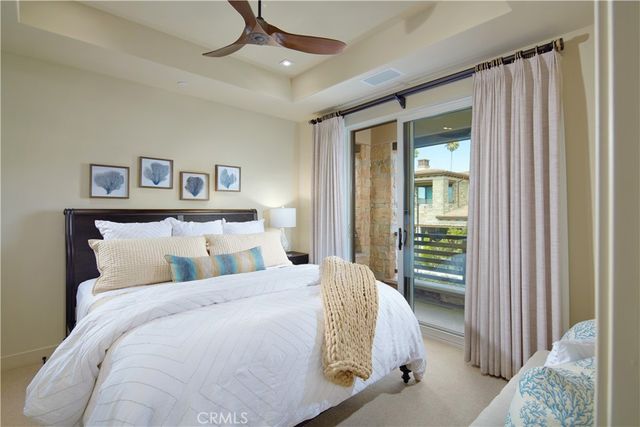 a bed room with a bed and a mirror