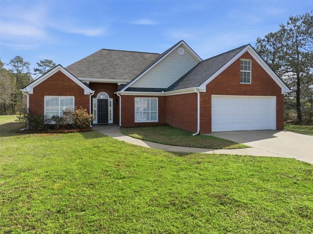 493 Youth Jersey Road Covington, GA 30014 - Photo 3 of 52 front view of a house with a yard