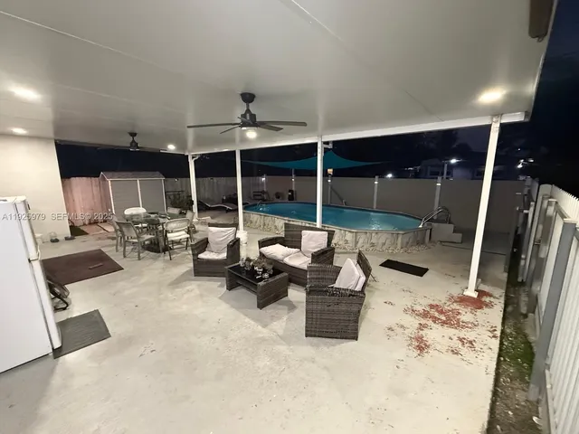 a group of chairs sitting in patio area of a kitchen