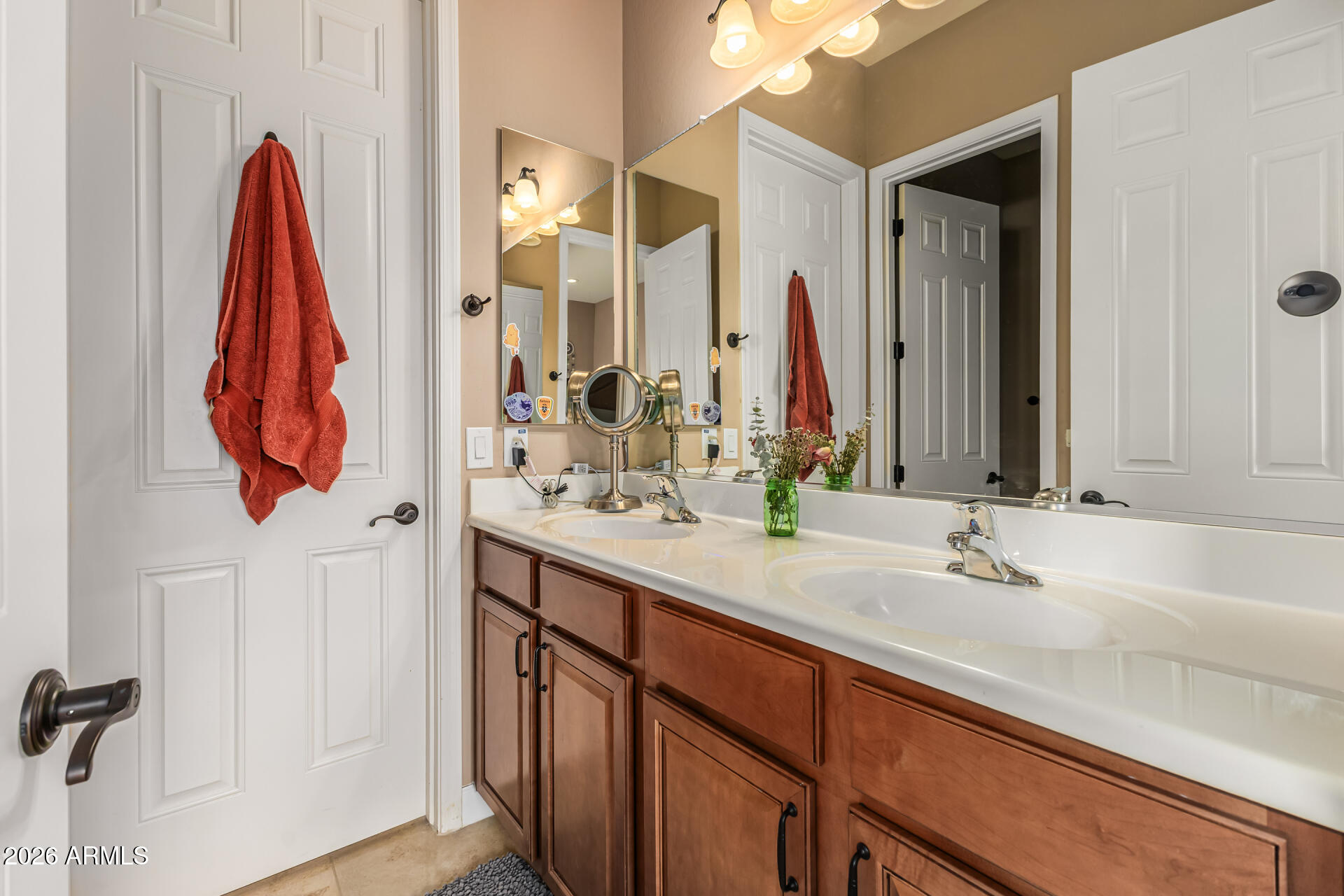 3139 East Harwell Road Phoenix, AZ 85042 - Photo 25 of 45 a bathroom with a sink and a mirror