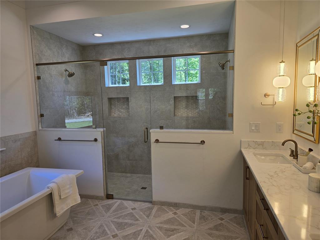 5990 Northwest 88th Street Gainesville, FL 32606 - Photo 11 of 11 a bathroom with a sink toilet and shower