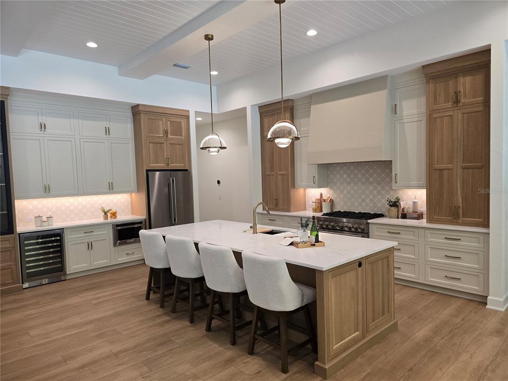 5990 Northwest 88th Street Gainesville, FL 32606 - Photo 4 of 11 a large kitchen with a table and chairs