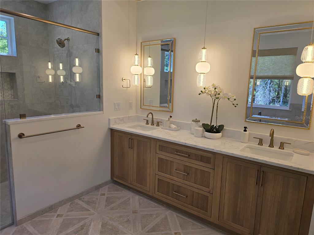 5990 Northwest 88th Street Gainesville, FL 32606 - Photo 10 of 11 a bathroom with a double vanity sink and a mirror