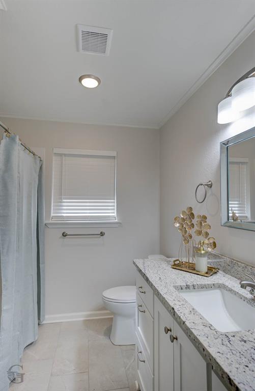 207 Chimney Lane Haughton, LA 71037 - Photo 11 of 18 Full bathroom with vanity, curtained shower, and ornamental molding