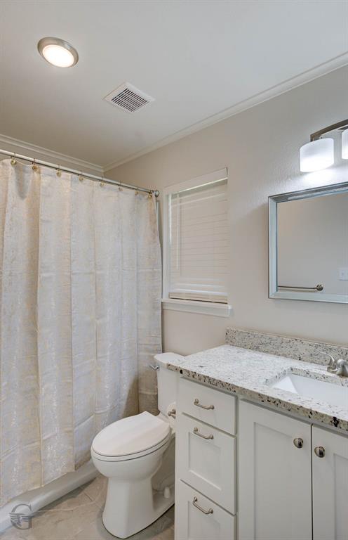 207 Chimney Lane Haughton, LA 71037 - Photo 13 of 18 Bathroom featuring vanity, a shower with shower curtain, crown molding, and light tile patterned floors