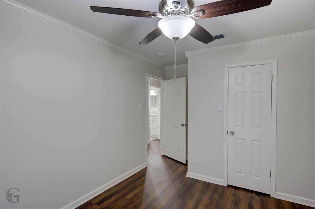 207 Chimney Lane Haughton, LA 71037 - Photo 14 of 18 Unfurnished bedroom featuring a ceiling fan, dark wood-style flooring, and crown molding