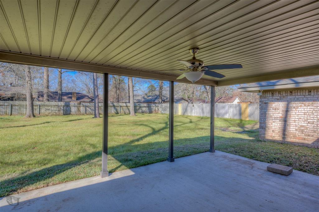 207 Chimney Lane Haughton, LA 71037 - Photo 17 of 18 Unfurnished sunroom with ceiling fan and a patio