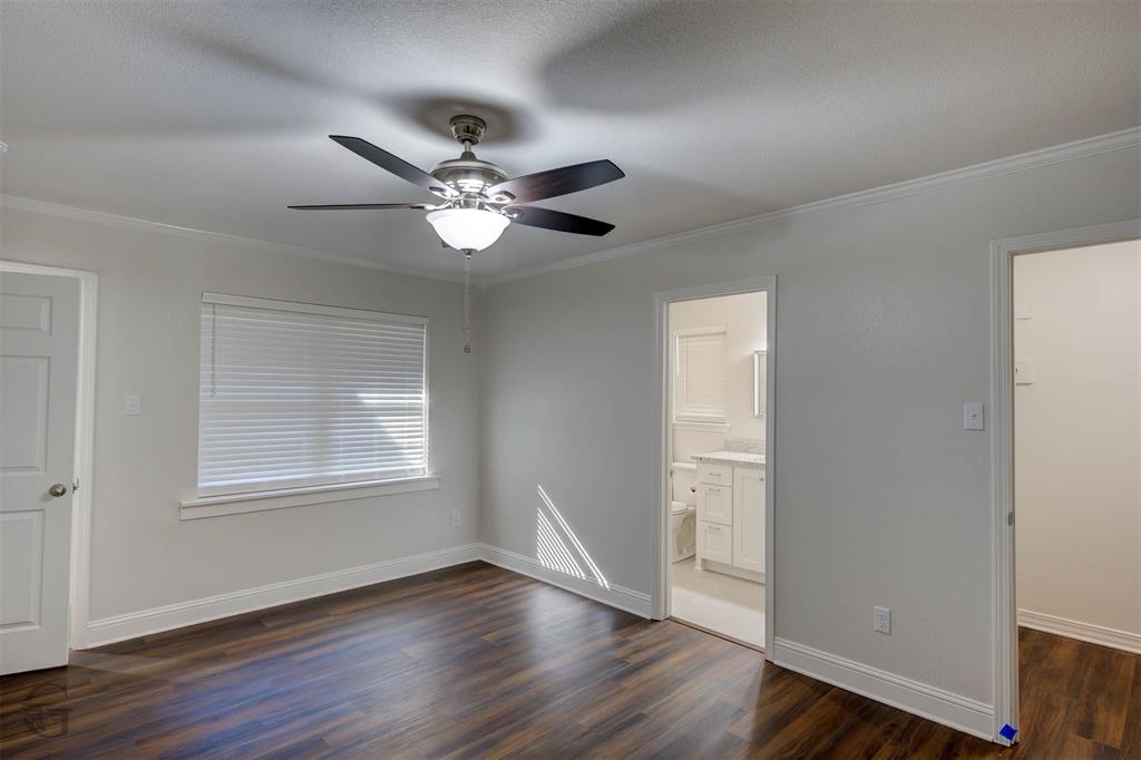 207 Chimney Lane Haughton, LA 71037 - Photo 10 of 18 Unfurnished bedroom featuring dark wood-style flooring, ceiling fan, and crown molding