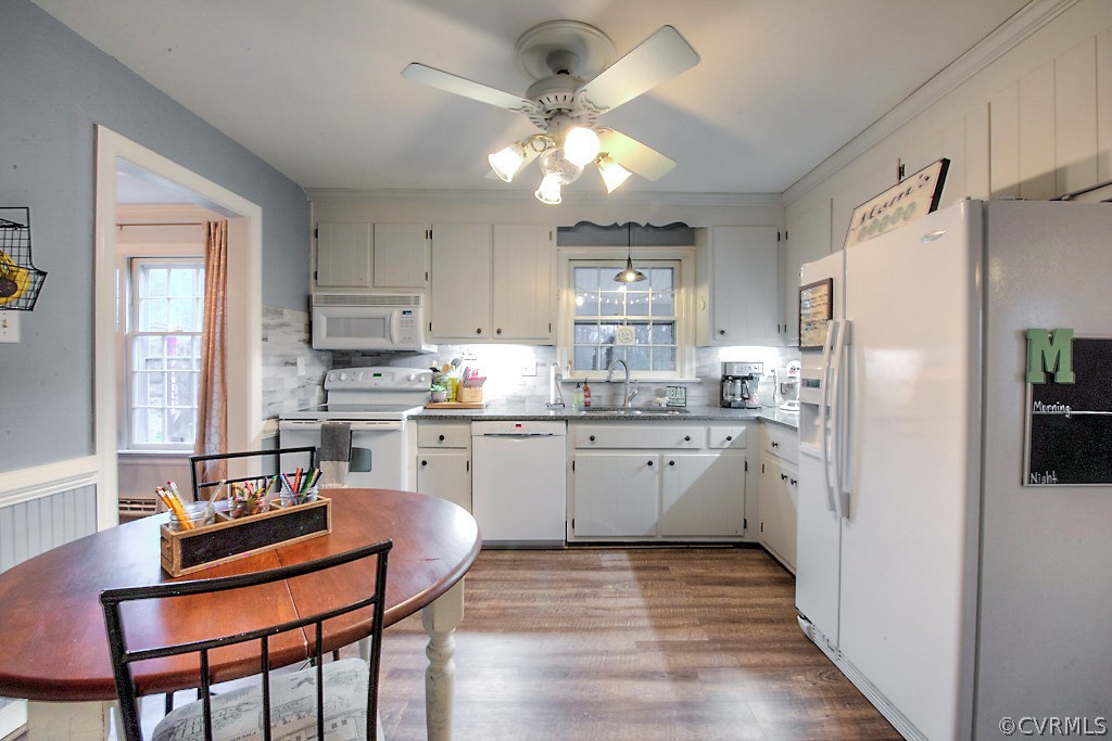 3919 Pebble Creek Road Midlothian, VA 23112 - Photo 15 of 46 a kitchen with stainless steel appliances granite countertop a refrigerator a sink dishwasher a stove with white cabinets and wooden floor