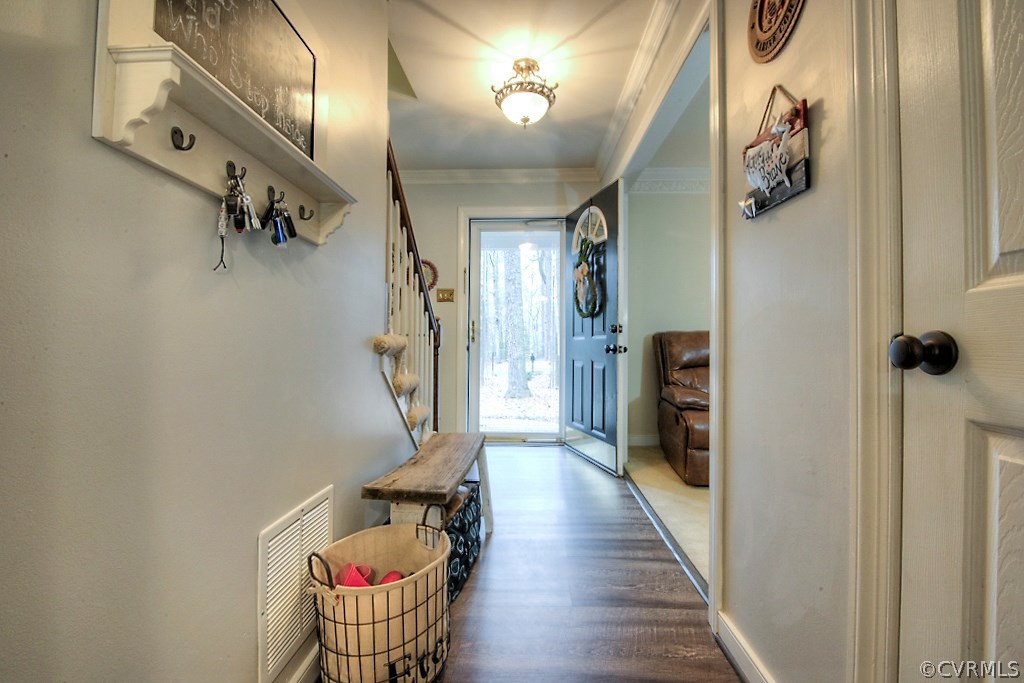3919 Pebble Creek Road Midlothian, VA 23112 - Photo 2 of 46 a hallway with a dining table chairs and stairs
