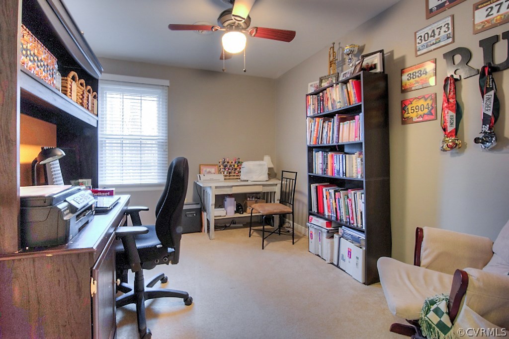 3919 Pebble Creek Road Midlothian, VA 23112 - Photo 24 of 46 a view of a workspace with furniture and a bookshelf