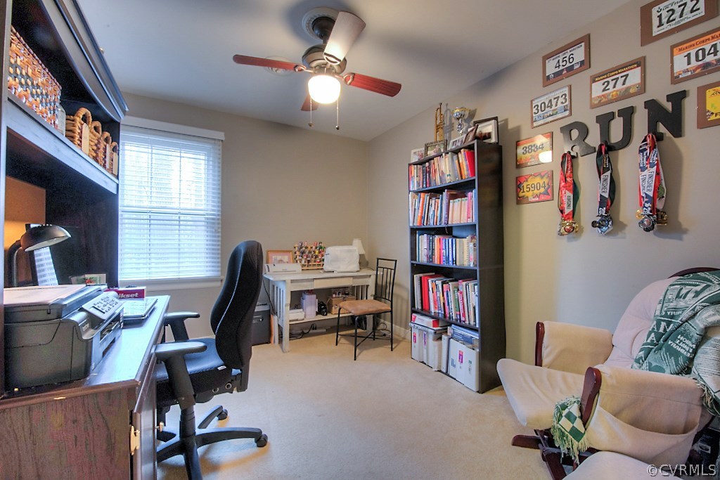 3919 Pebble Creek Road Midlothian, VA 23112 - Photo 25 of 46 a view of a workspace with furniture and a bookshelf
