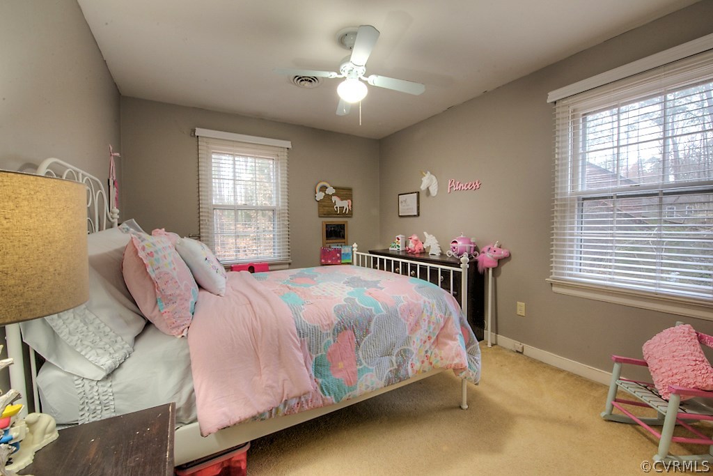3919 Pebble Creek Road Midlothian, VA 23112 - Photo 26 of 46 a bedroom with a bed and a chandelier
