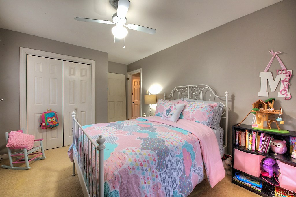 3919 Pebble Creek Road Midlothian, VA 23112 - Photo 27 of 46 a bedroom with a bed and a chandelier