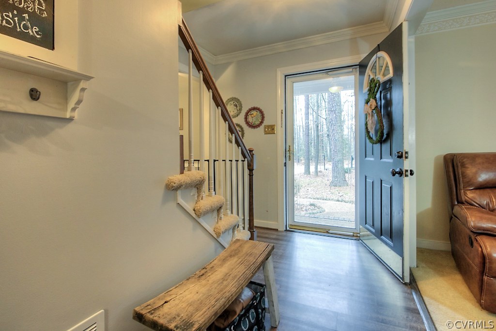 3919 Pebble Creek Road Midlothian, VA 23112 - Photo 3 of 46 a view of a hallway with wooden floor and staircase