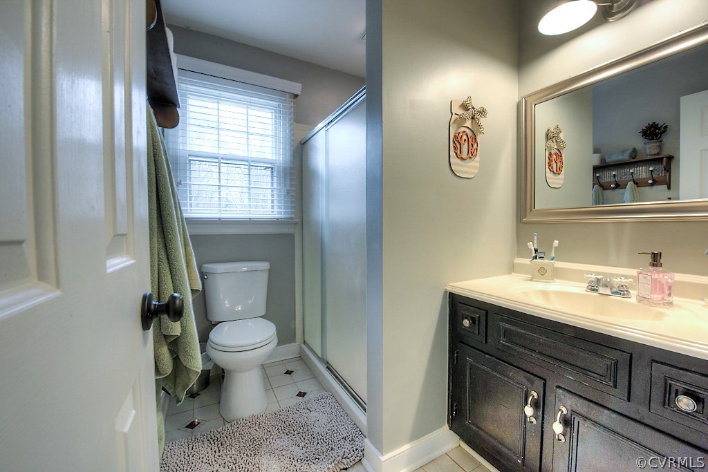 3919 Pebble Creek Road Midlothian, VA 23112 - Photo 33 of 46 a bathroom with a sink a toilet and shower