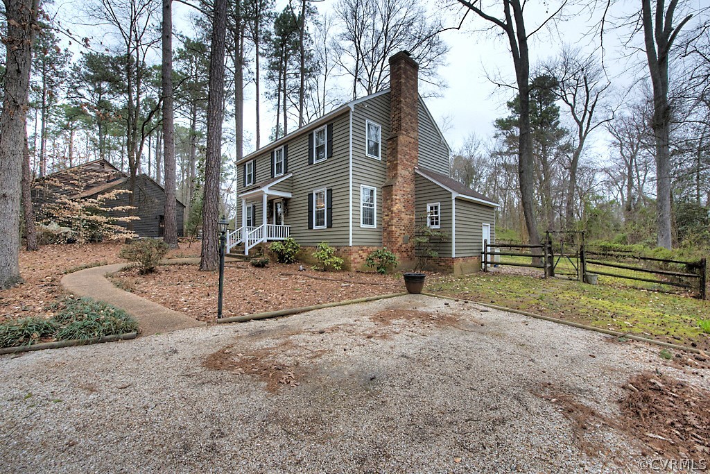 3919 Pebble Creek Road Midlothian, VA 23112 - Photo 42 of 46 a view of a house with a yard and large trees