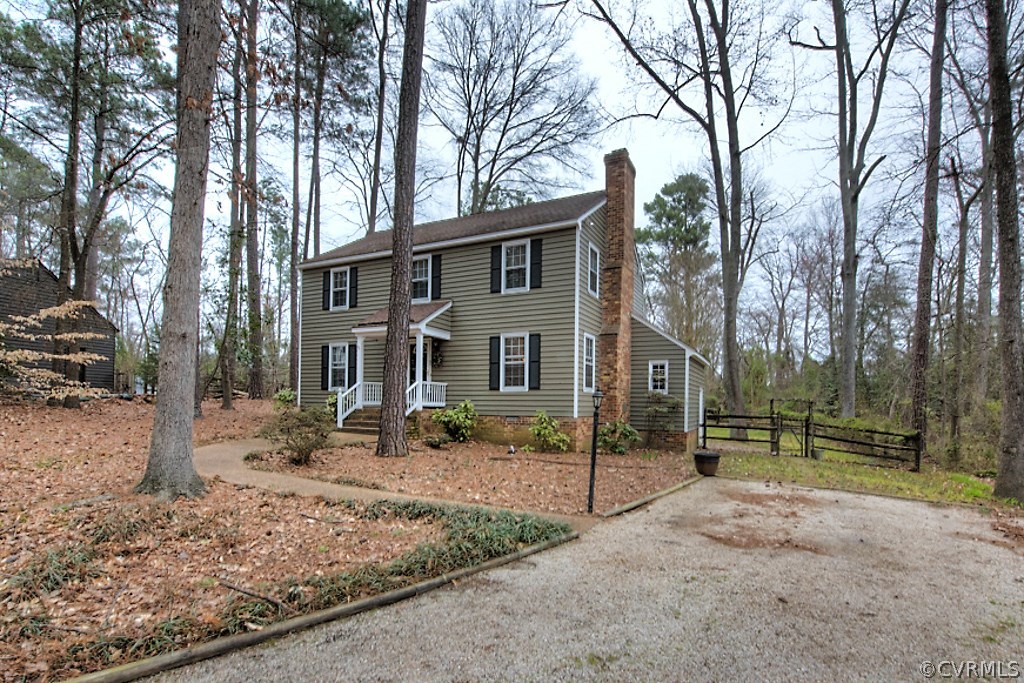 3919 Pebble Creek Road Midlothian, VA 23112 - Photo 43 of 46 a view of a house with a yard covered in snow
