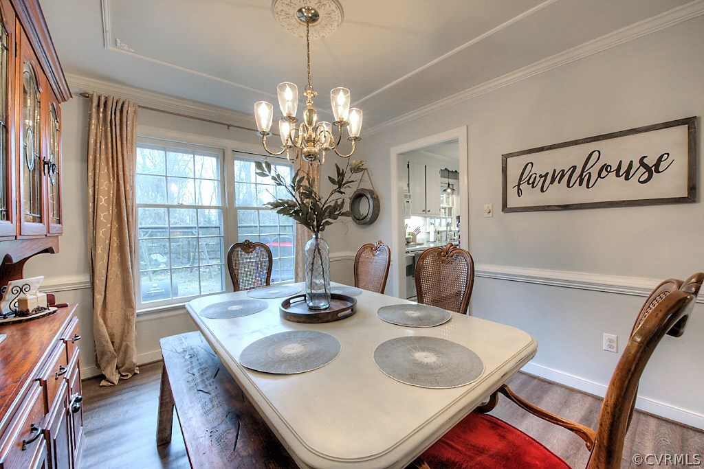 3919 Pebble Creek Road Midlothian, VA 23112 - Photo 10 of 46 a view of a dining room with furniture window and wooden floor
