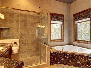 74 452nd Road, Unit COUNTY Breckenridge, CO 80424 - Photo 12 of 22 a bathroom with a bathtub and shower