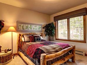 74 452nd Road, Unit COUNTY Breckenridge, CO 80424 - Photo 15 of 22 a bedroom with a bed and a window
