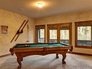 74 452nd Road, Unit COUNTY Breckenridge, CO 80424 - Photo 20 of 22 a room with furniture pool table and windows
