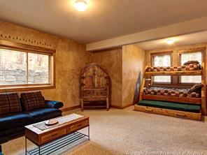 74 452nd Road, Unit COUNTY Breckenridge, CO 80424 - Photo 21 of 22 a living room with furniture a rug and a window
