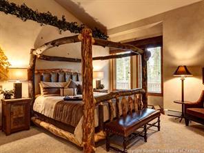 74 452nd Road, Unit COUNTY Breckenridge, CO 80424 - Photo 10 of 22 a bedroom with furniture and a window