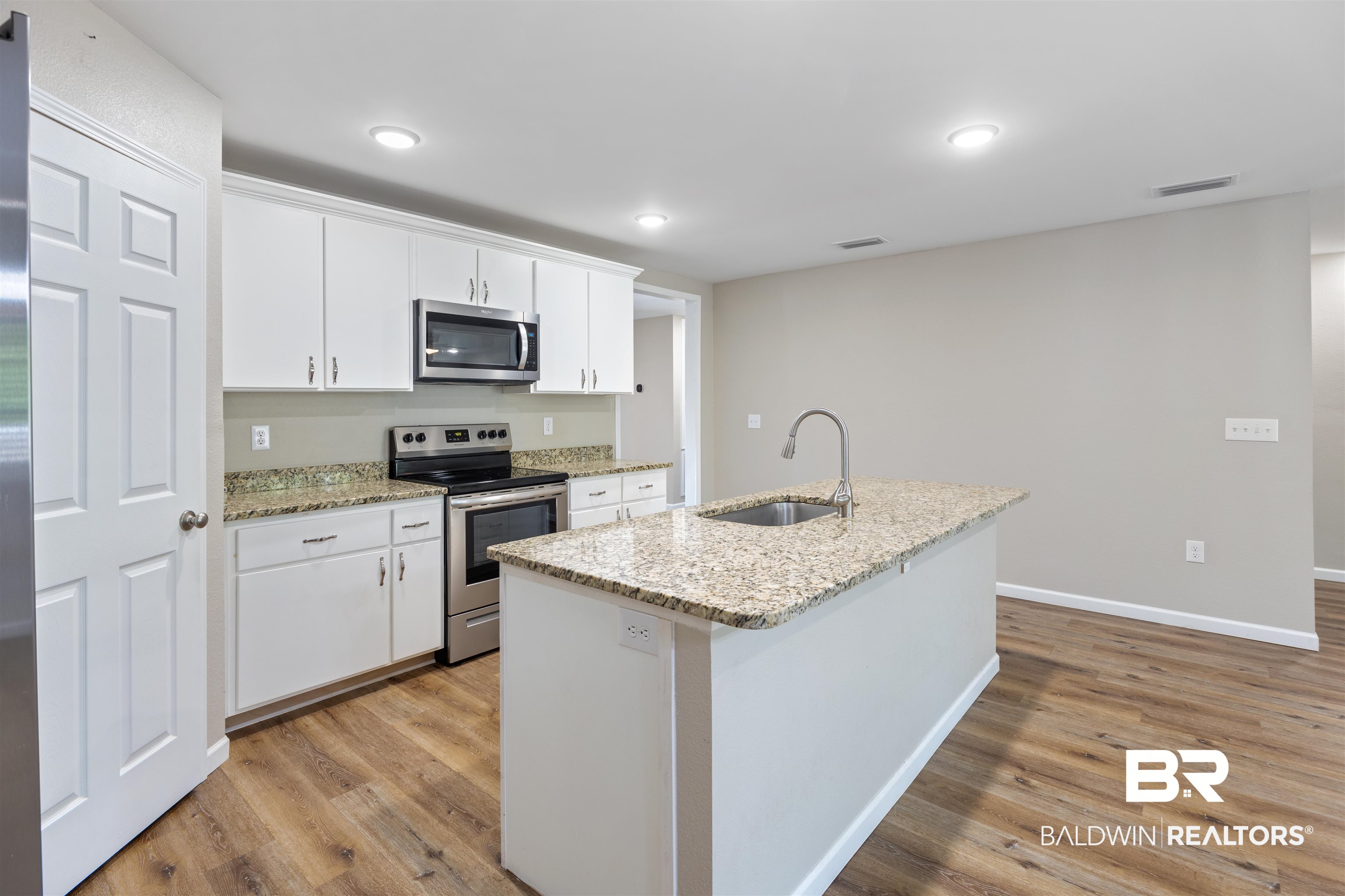 7456 Coppin Drive Foley, AL 36535 - Photo 3 of 32 Kitchen features granite counters & stainless appliances