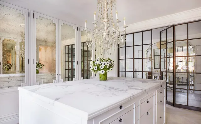 a large white bed in a white room