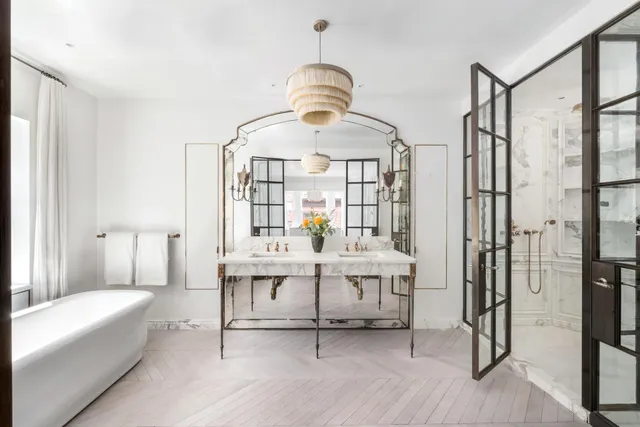 a kitchen with a granite countertop sink and white cabinets