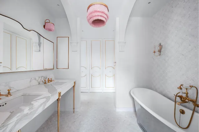 a spacious bedroom with a bed and a large window