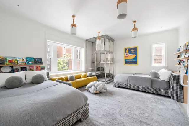 a bedroom with furniture and a window