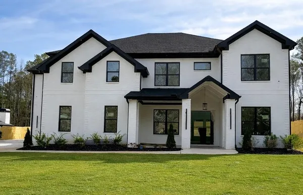 a front view of a house with a yard