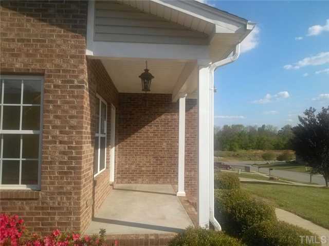 710 Ralph Graham Drive Graham, NC 27253 - Photo 3 of 14 Rocking chair front porch allows you to sit and enjoy the neighborhood.